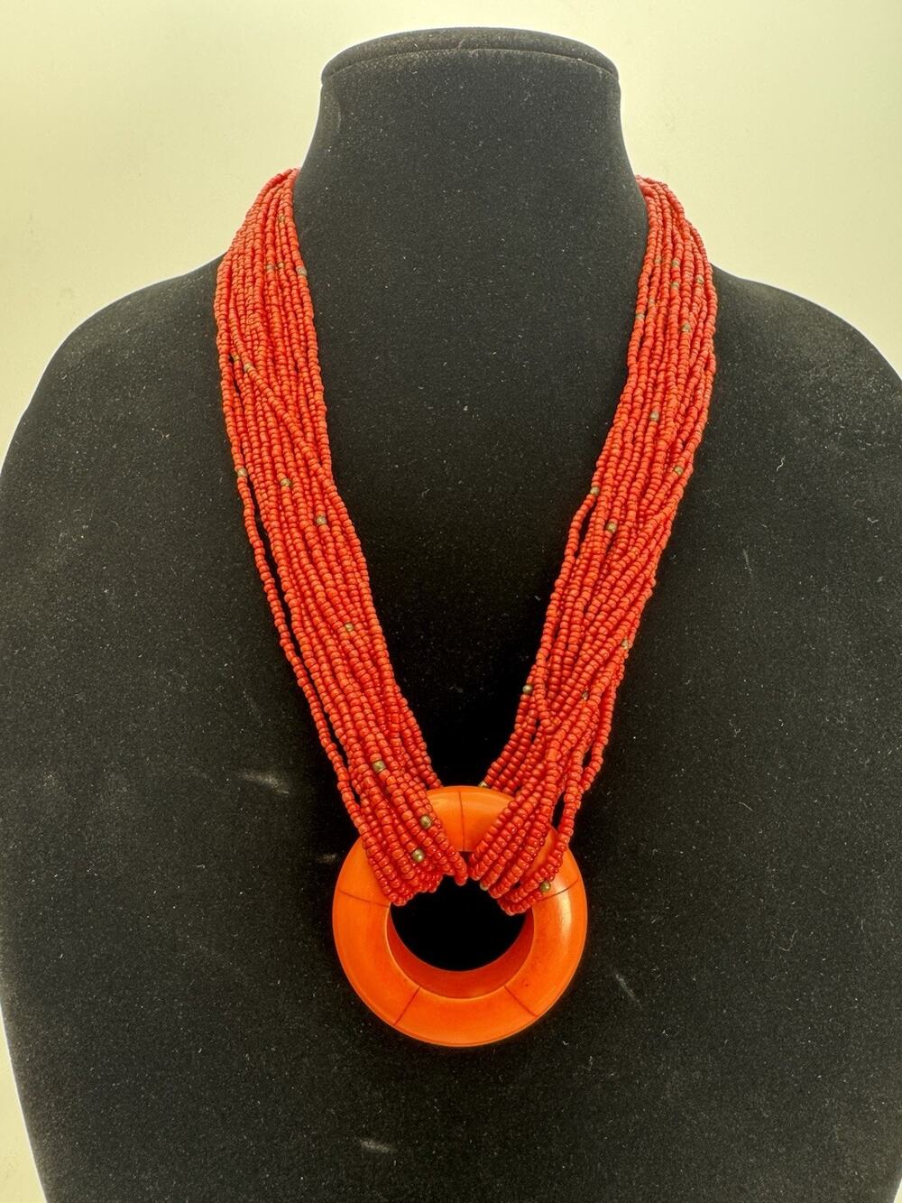 Red Multi Strand Seed Bead Statement Necklace With Chunky Open Center Pendant